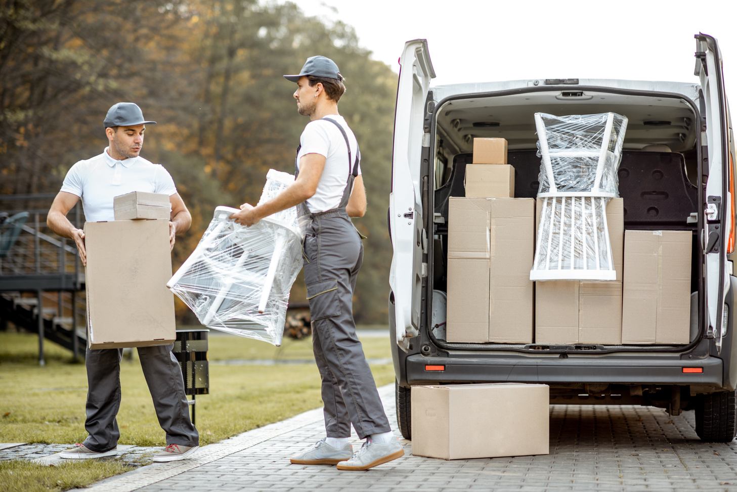 Delivery Company Employees Unloading Cargo Van Vehicle